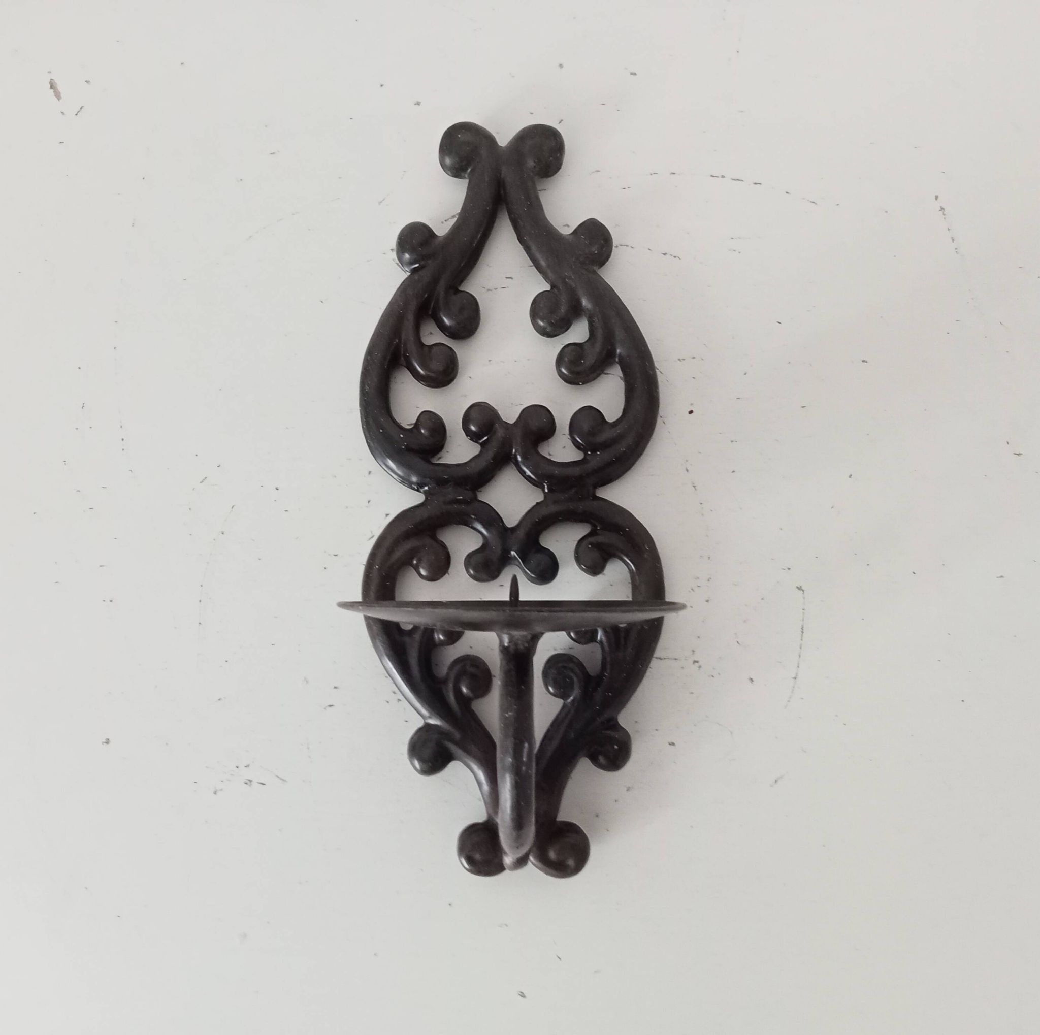 Antique wall candle holder in enamelled cast iron