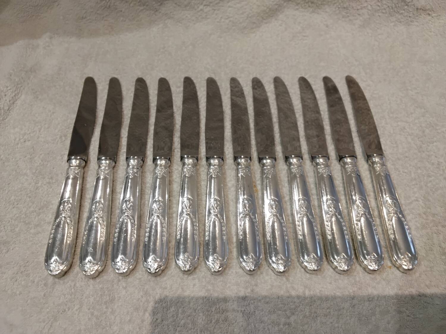 12 silver-plated metal table knives by the silversmith Ravinet Denfert, Empire style, model 81.