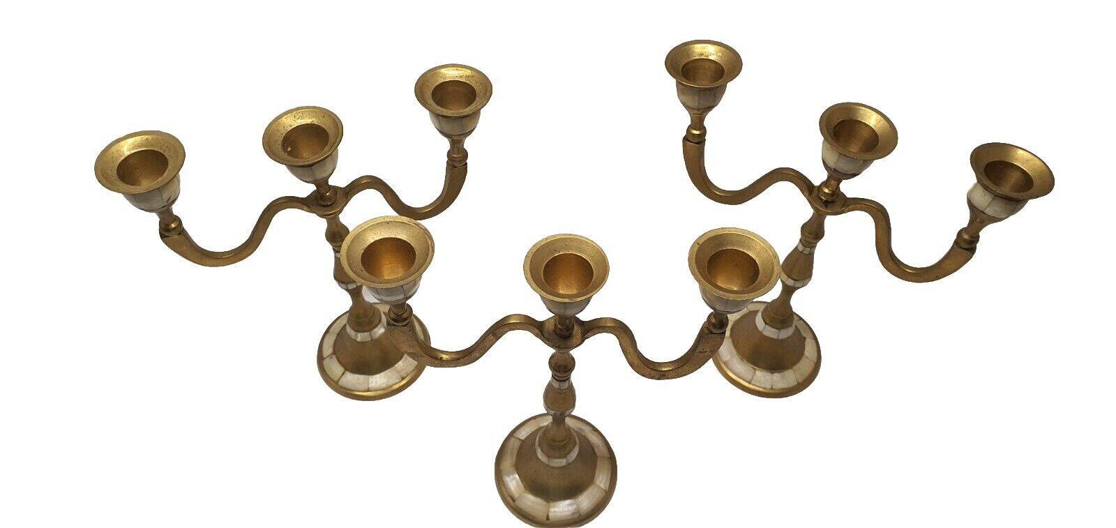 Set of 3-light brass candlesticks with mother-of-pearl intrusion