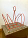 Vintage orange metal magazine rack, 1970s