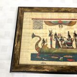 Egyptian papyrus under glass in wooden frame
