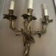 Pair of Louis XV style wall lights, rocaille with three branches in bronze.