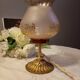 Bronze foot table lamp, satin amber lampshade, circa 1960