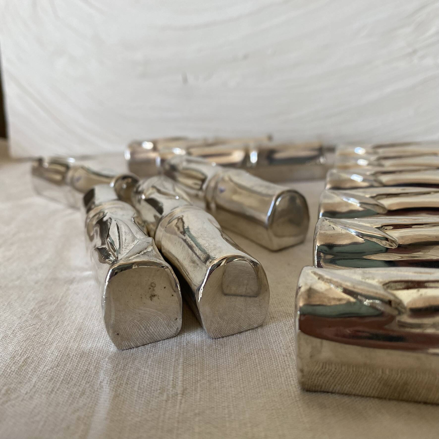 Silver bamboo knife rests from the 1980s.