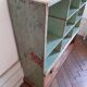 Old library shelf in patinated grocery tree