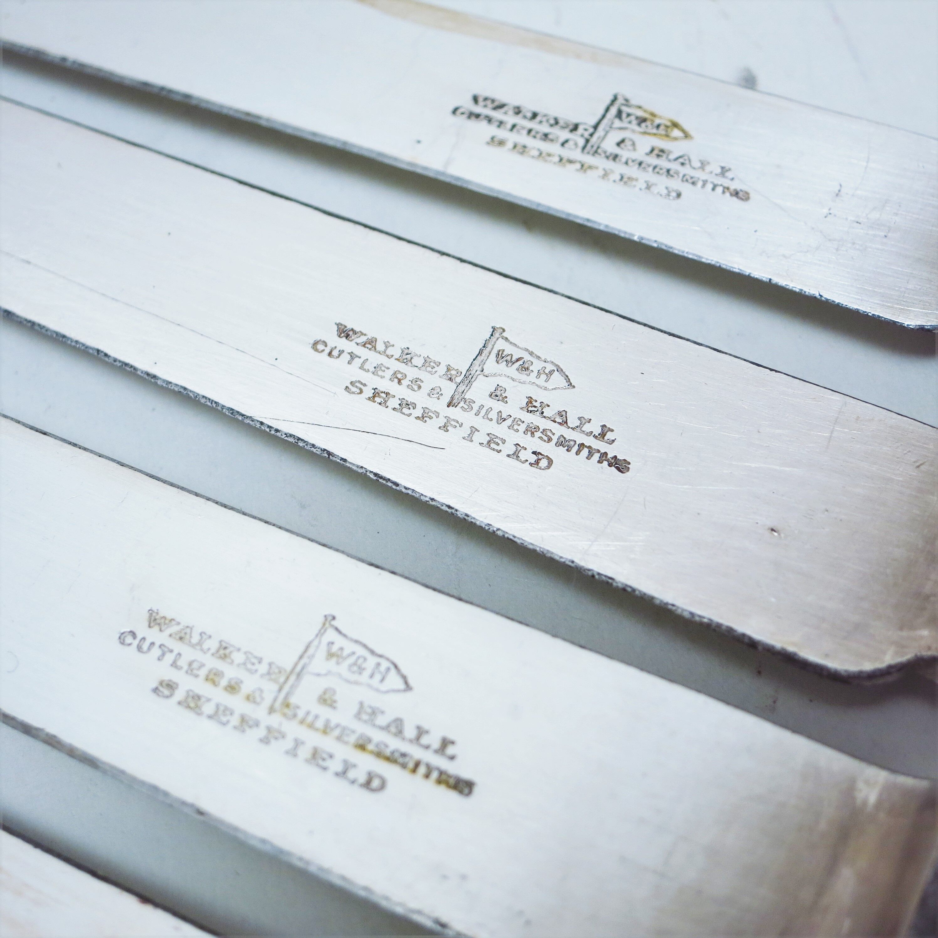 Set of four silver metal knives