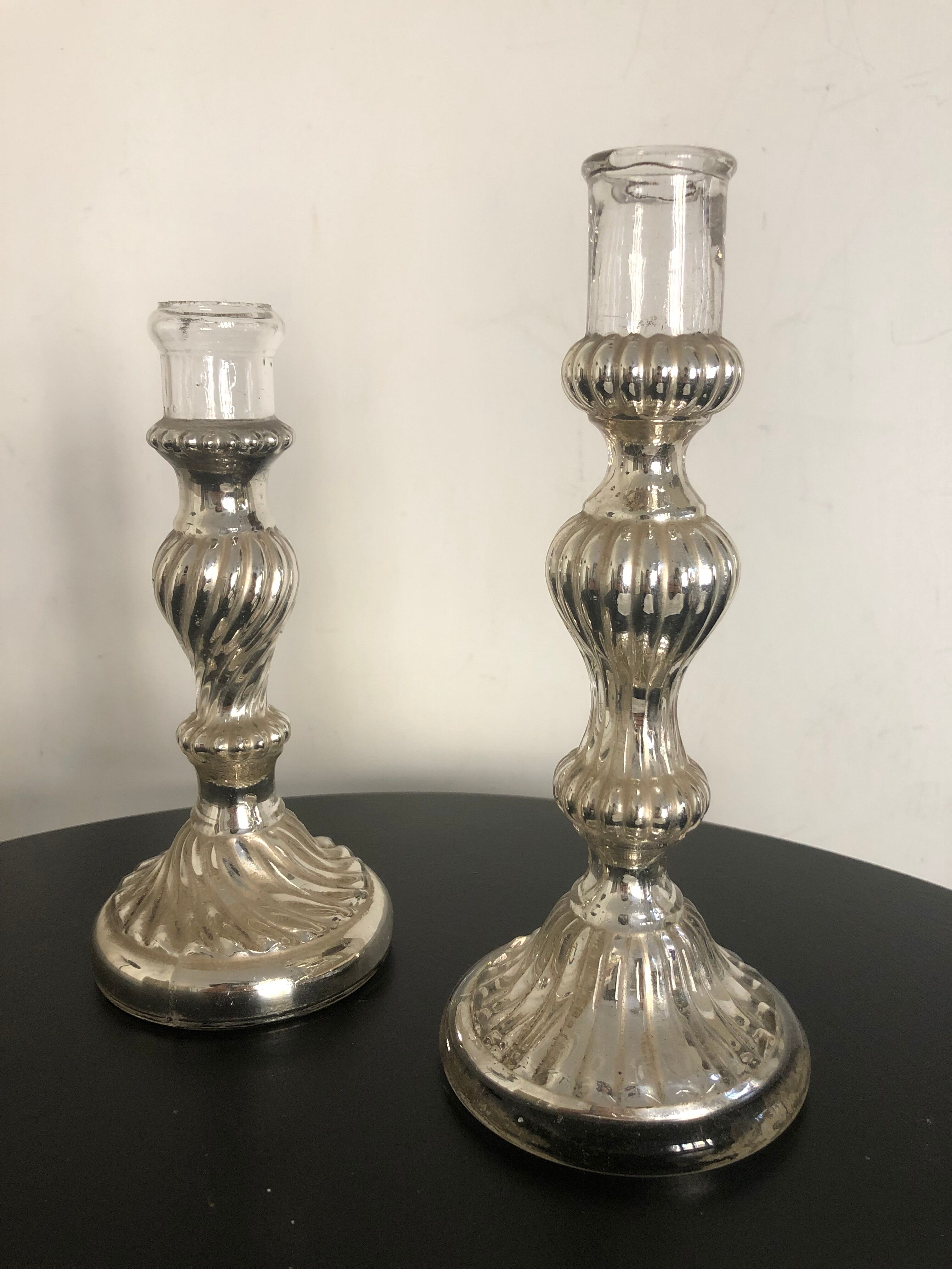 Pair of mercerized candle holders