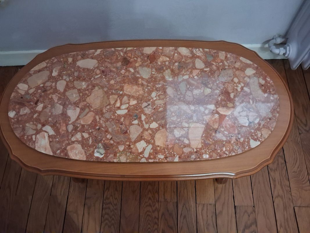 Coffee table with a stone top.