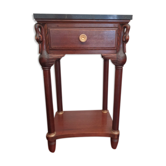 Bedside on black marble swan head