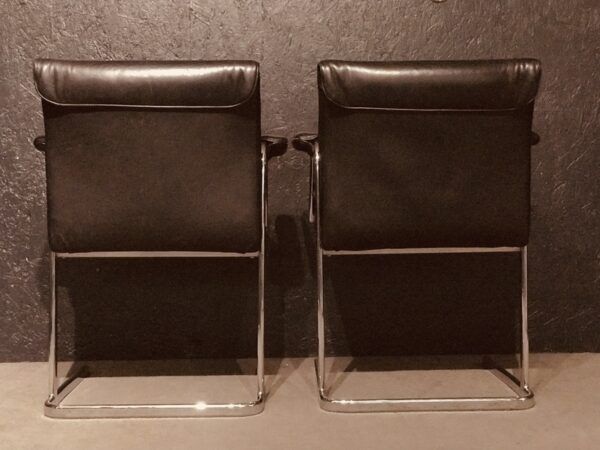 Pair of black leather Scandinavian armchairs