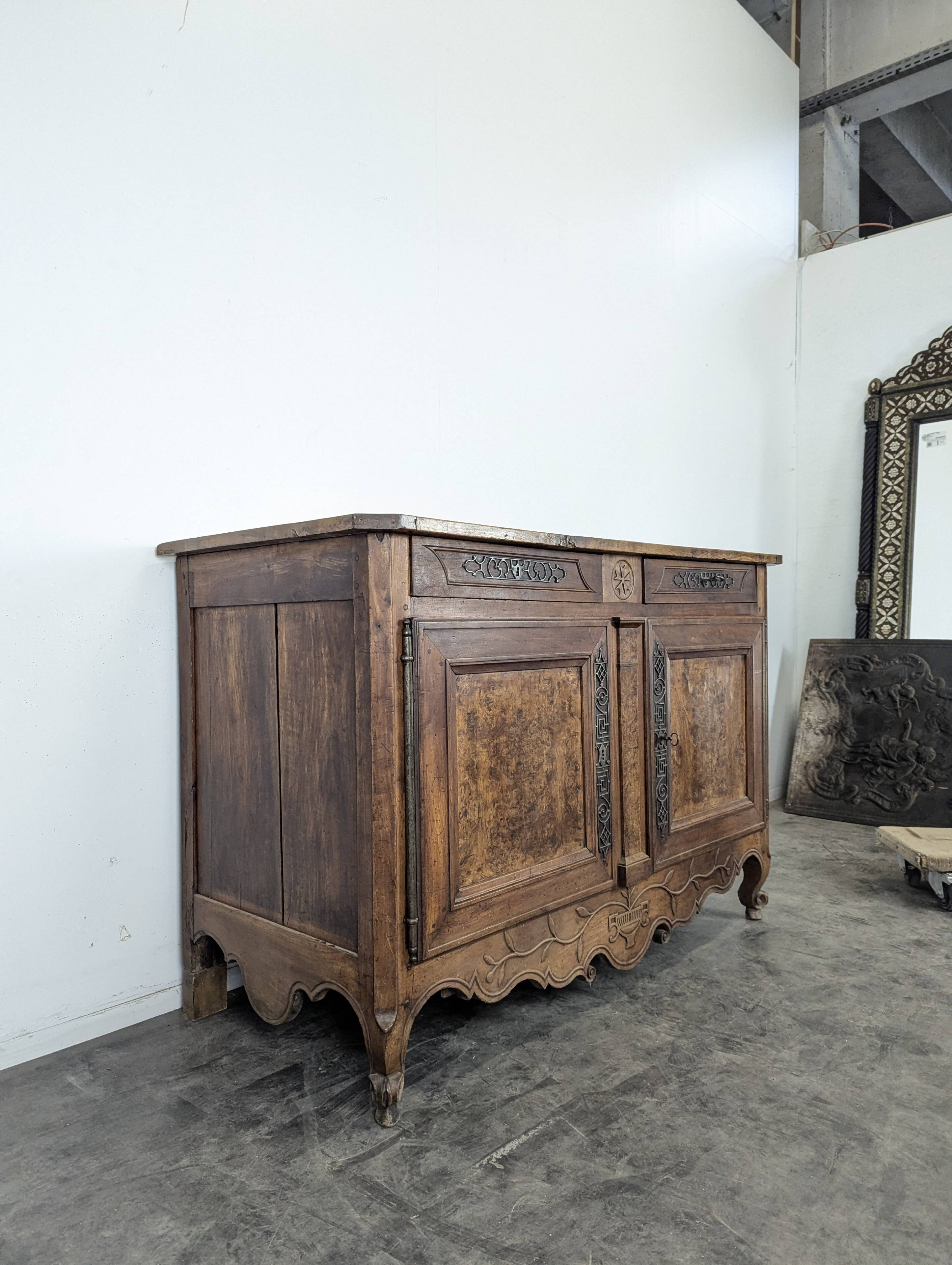 Louis XV-style buffet in walnut and burl with openwork fittings.