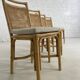 Suite de 4 chaises en rotin cannage et laiton