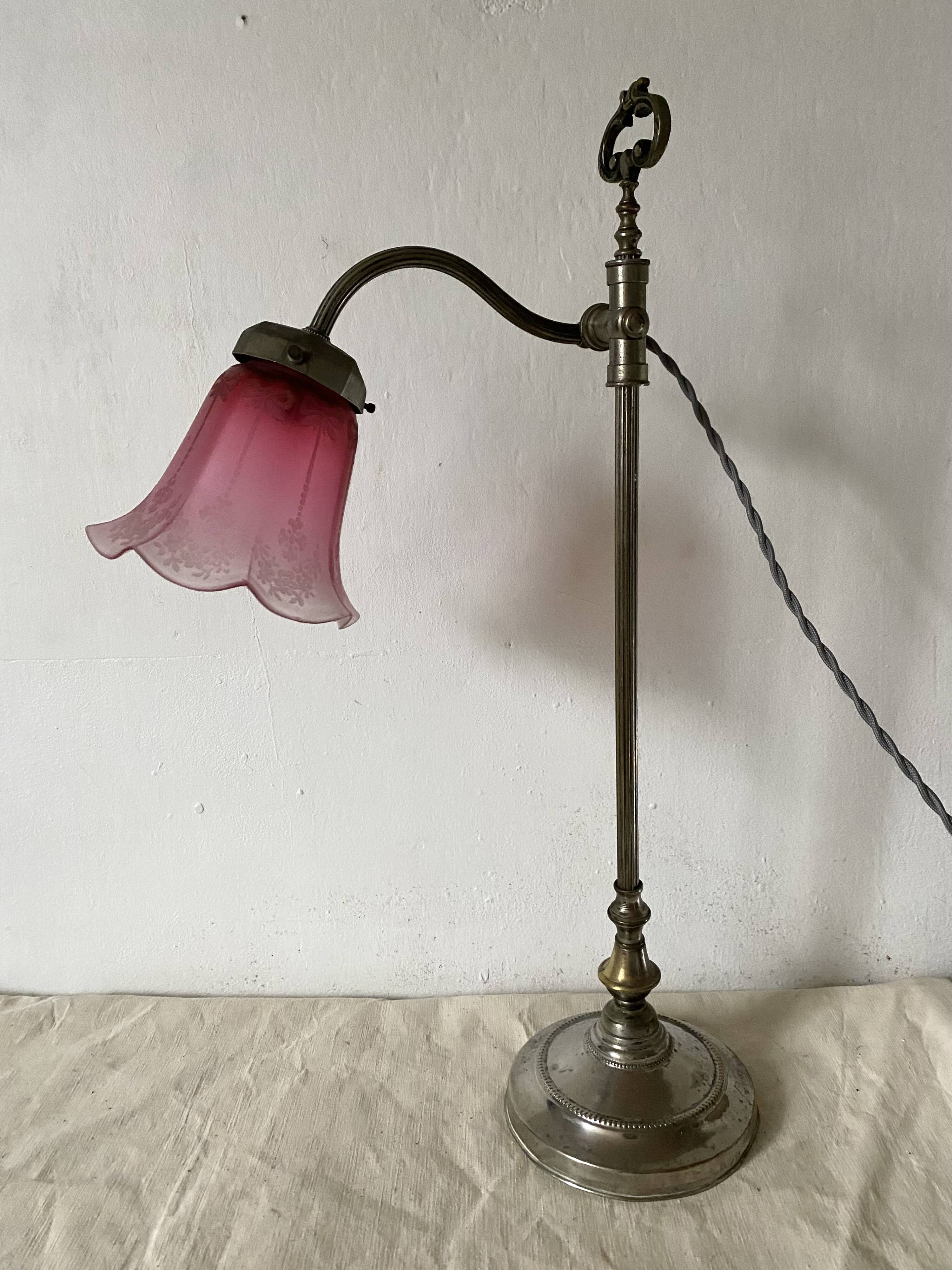 Antique jeweller's lamp, silver-plated base, frosted pink glass shade.