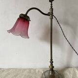 Antique jeweller's lamp, silver-plated base, frosted pink glass shade.