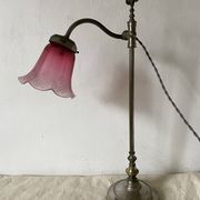 Antique jeweller's lamp, silver-plated base, frosted pink glass shade.
