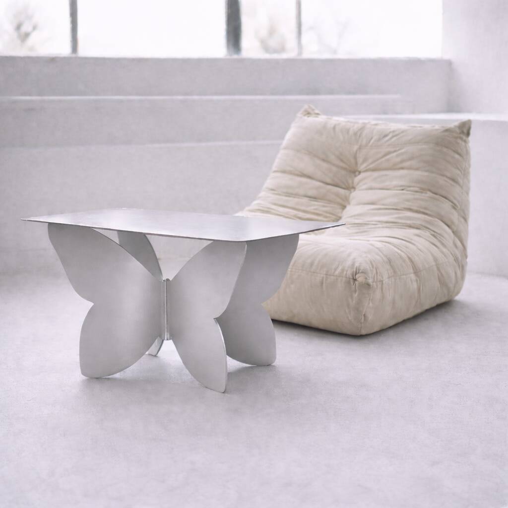 Papillon – Table basse design en acier inoxydable brossé