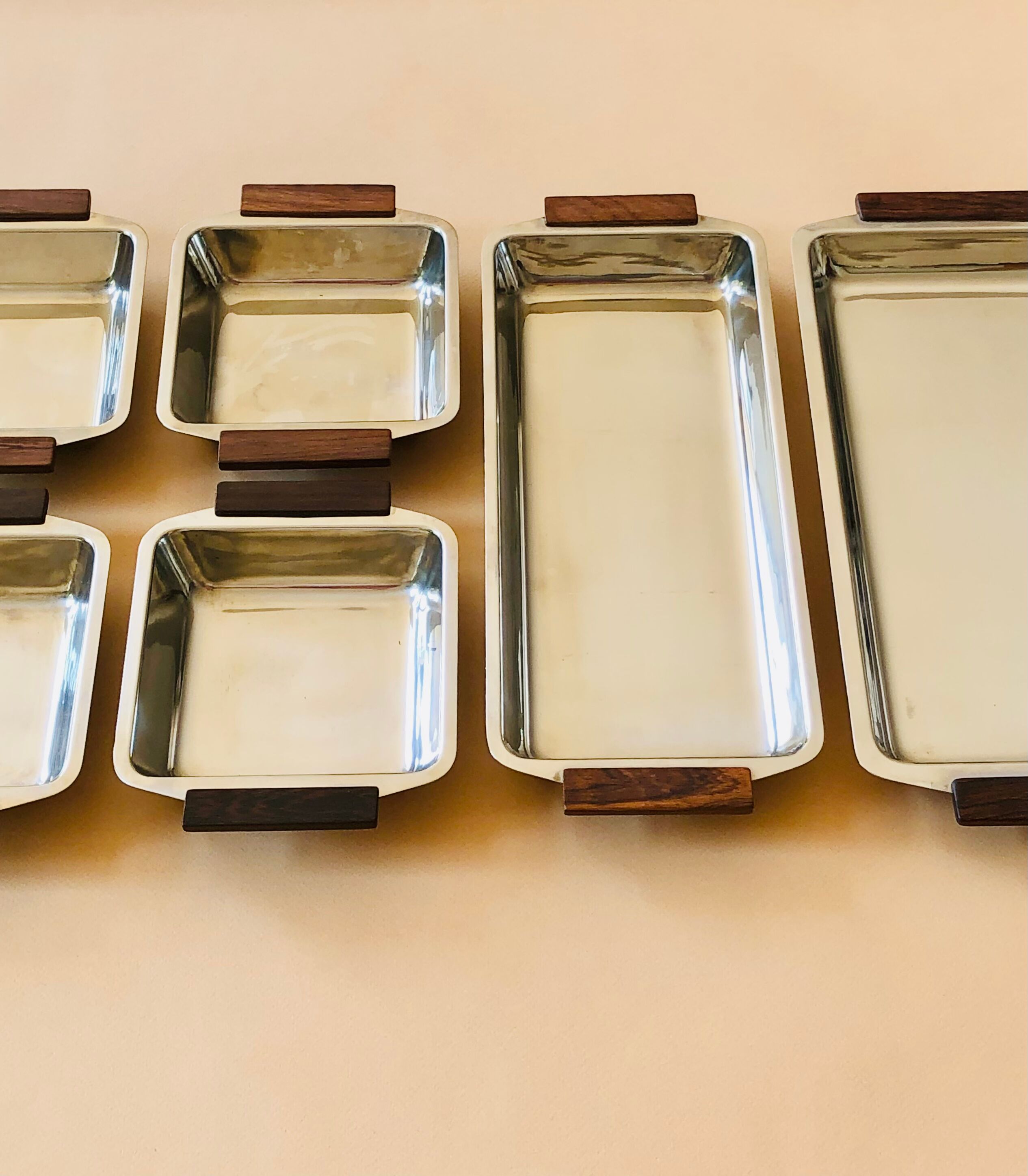 Service of Scandinavian dishes in stainless steel and teak 1970