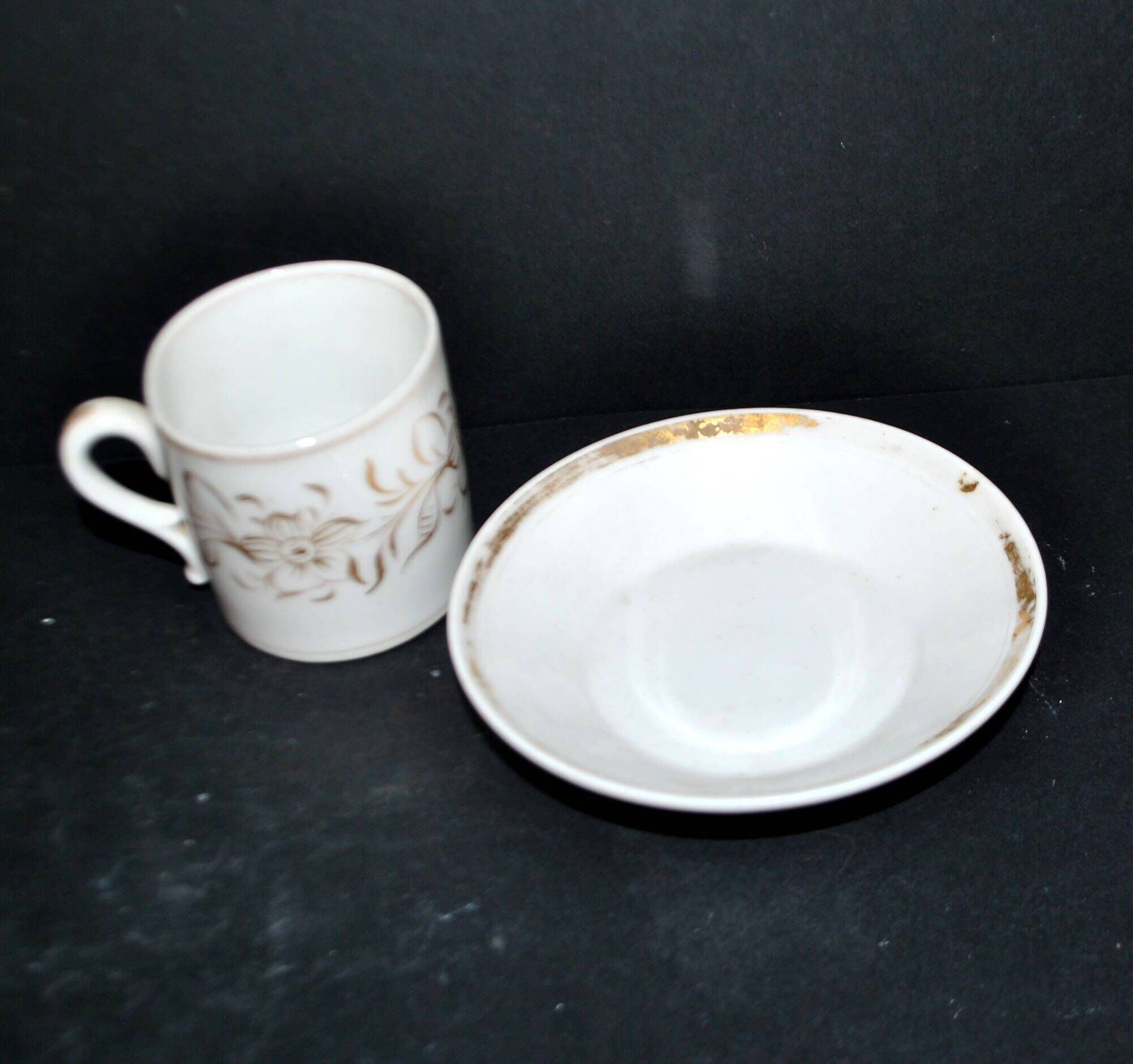 Paris porcelain coffee cup with floral design, antique porcelain with gold trim.