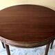 Extendable half-moon table in Louis XVI style