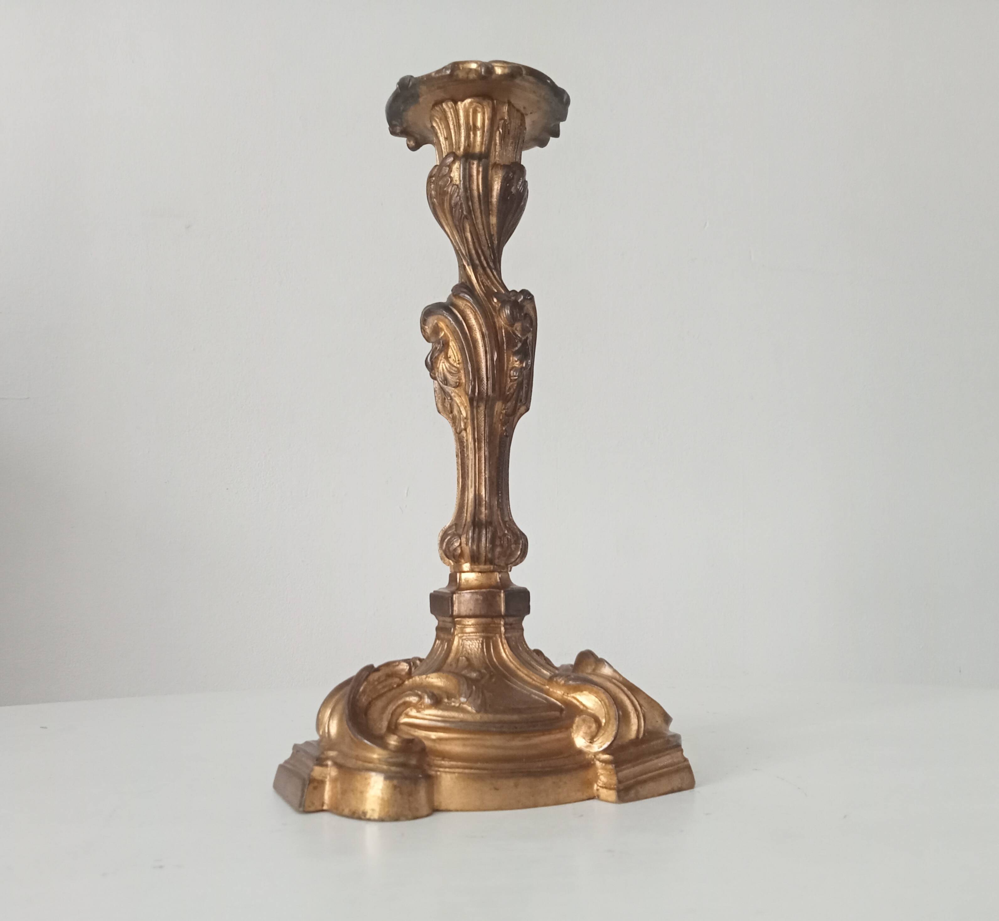 Antique 19th-century solid gilded bronze candlestick in the Louis XV style.