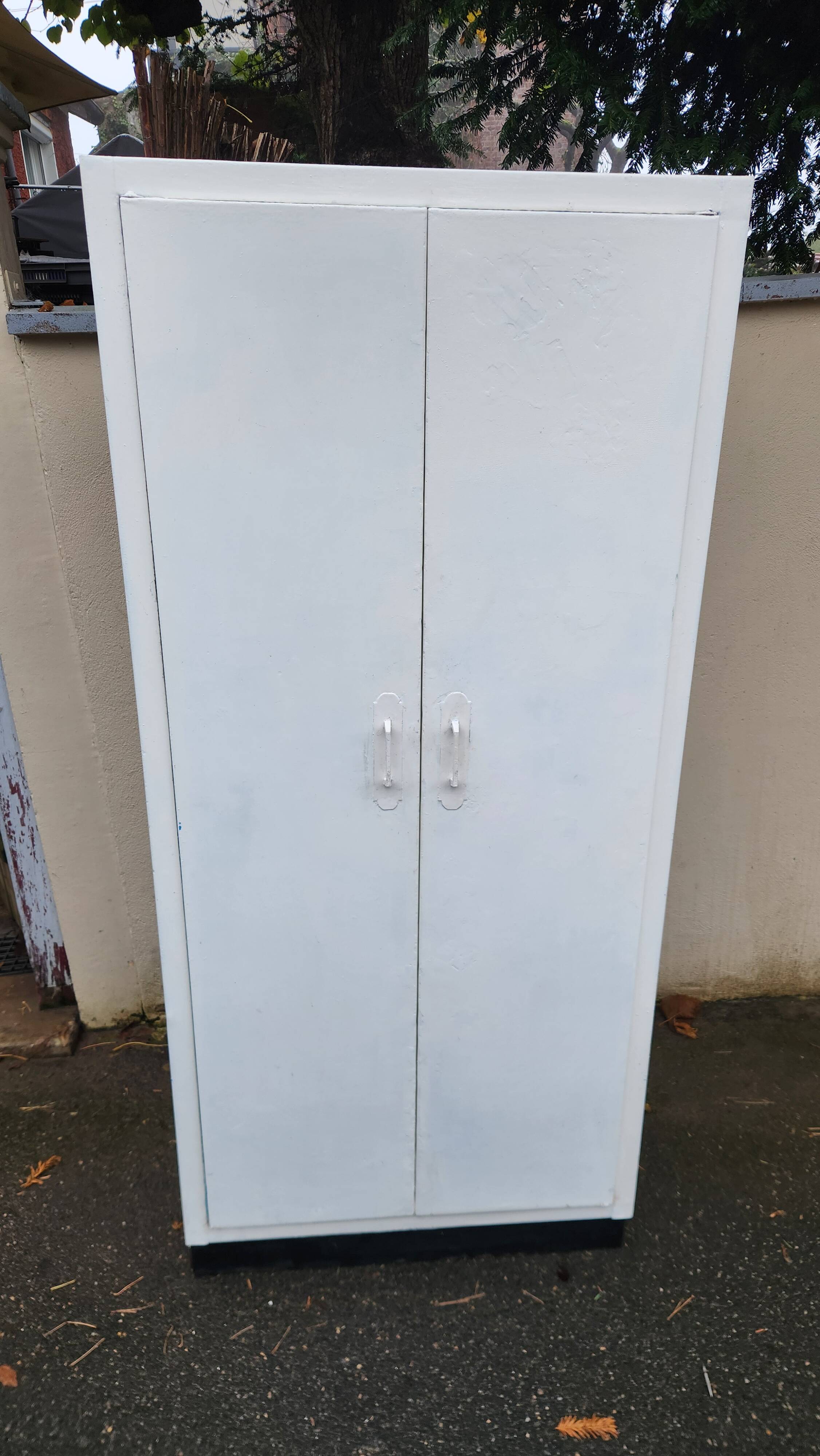 Old industrial metal cabinet in white and blue.