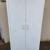 Old industrial metal cabinet in white and blue.