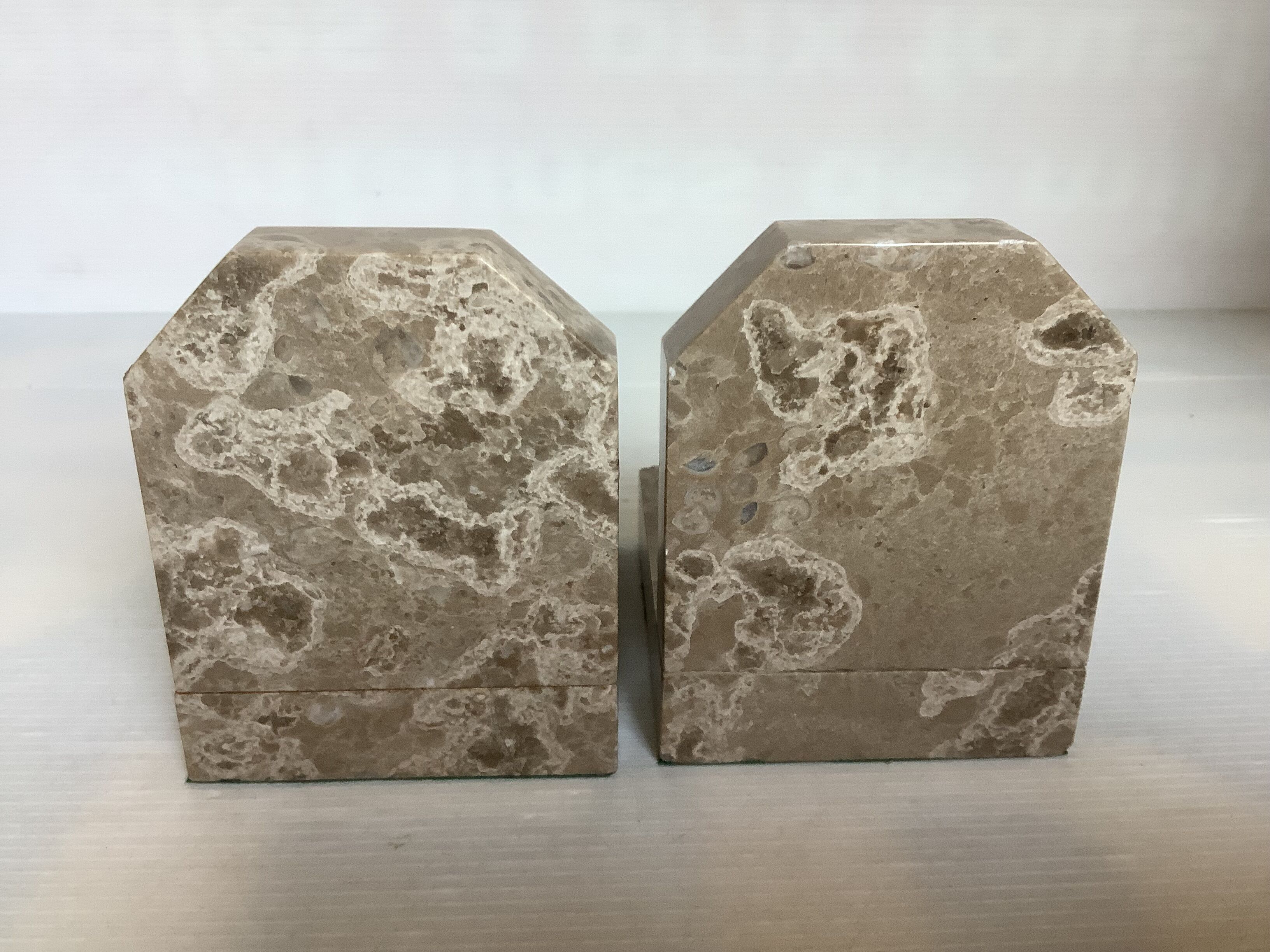 Pair of beige marble bookends.