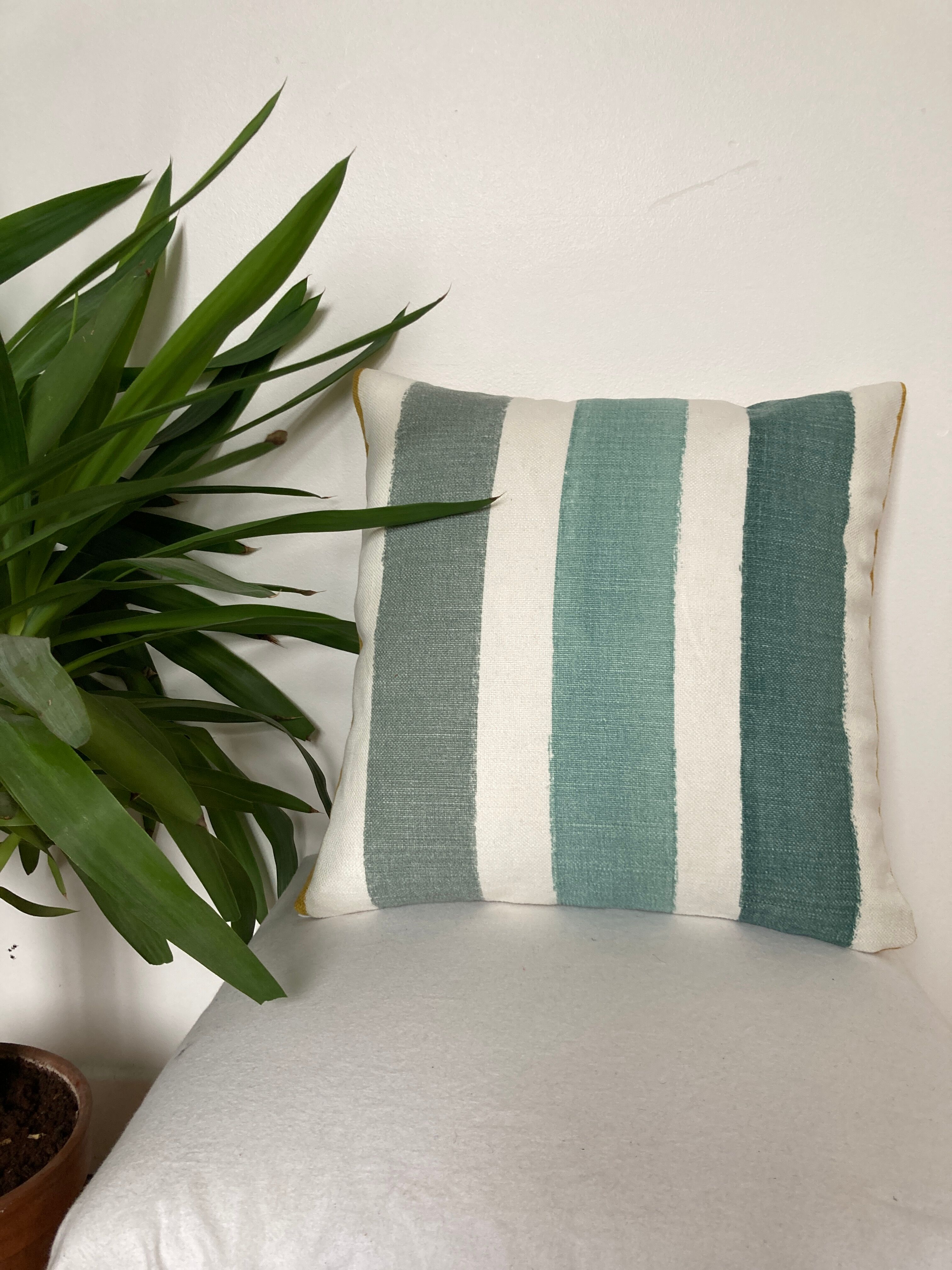 Two-sided stripe cushion solid green tones mustard