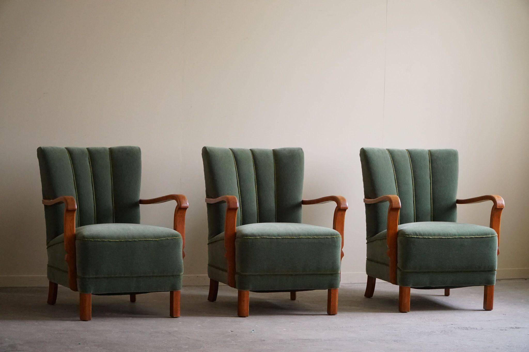 Danish Art Deco, set of 3 oak armchairs, reupholstered in green mohair, 1930s.