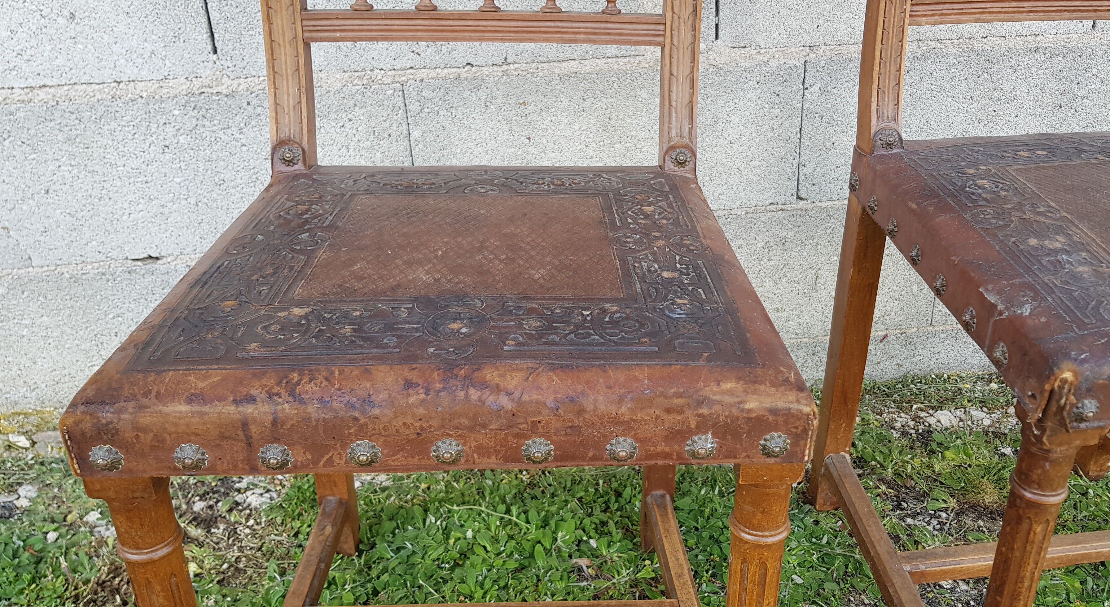 2 seat chairs and leather backrest