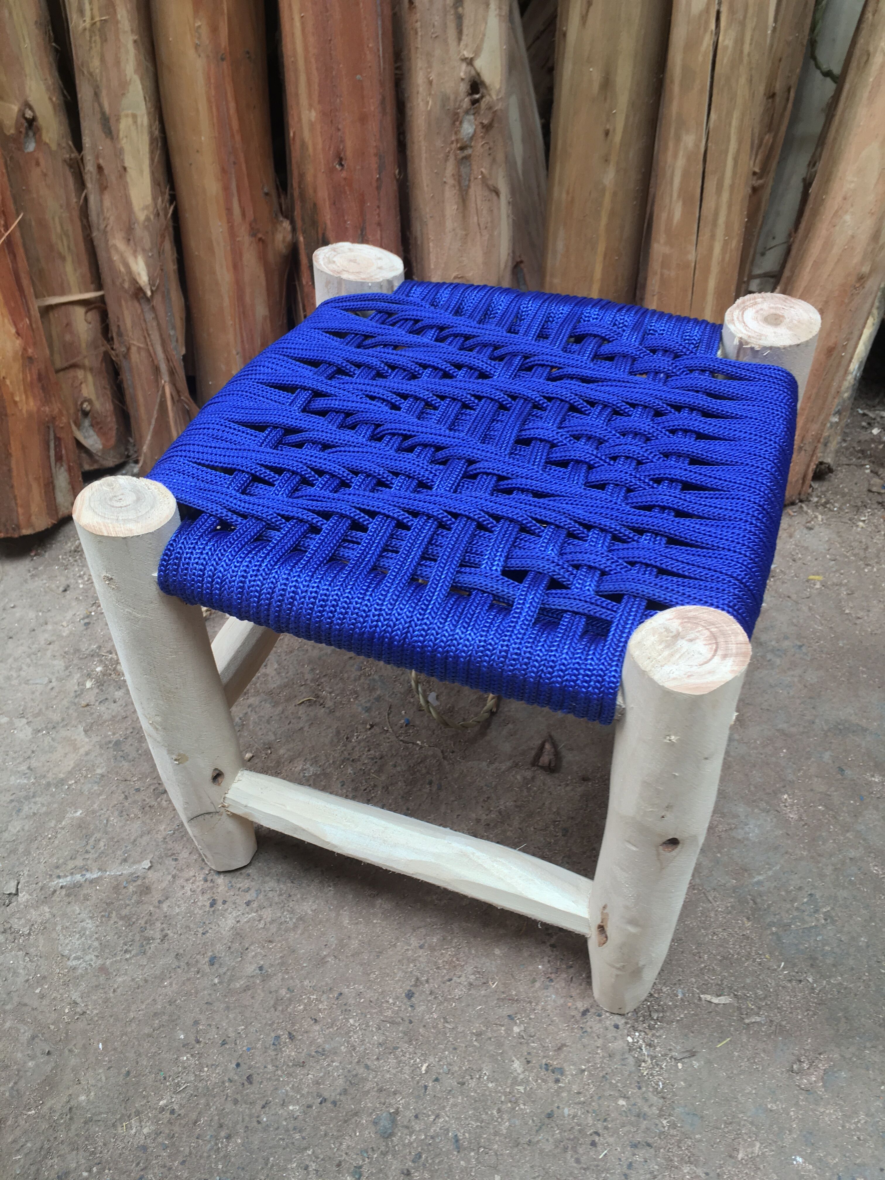 Traditional moroccan stool in blue nylon thread majorelle and eucalyptus wood