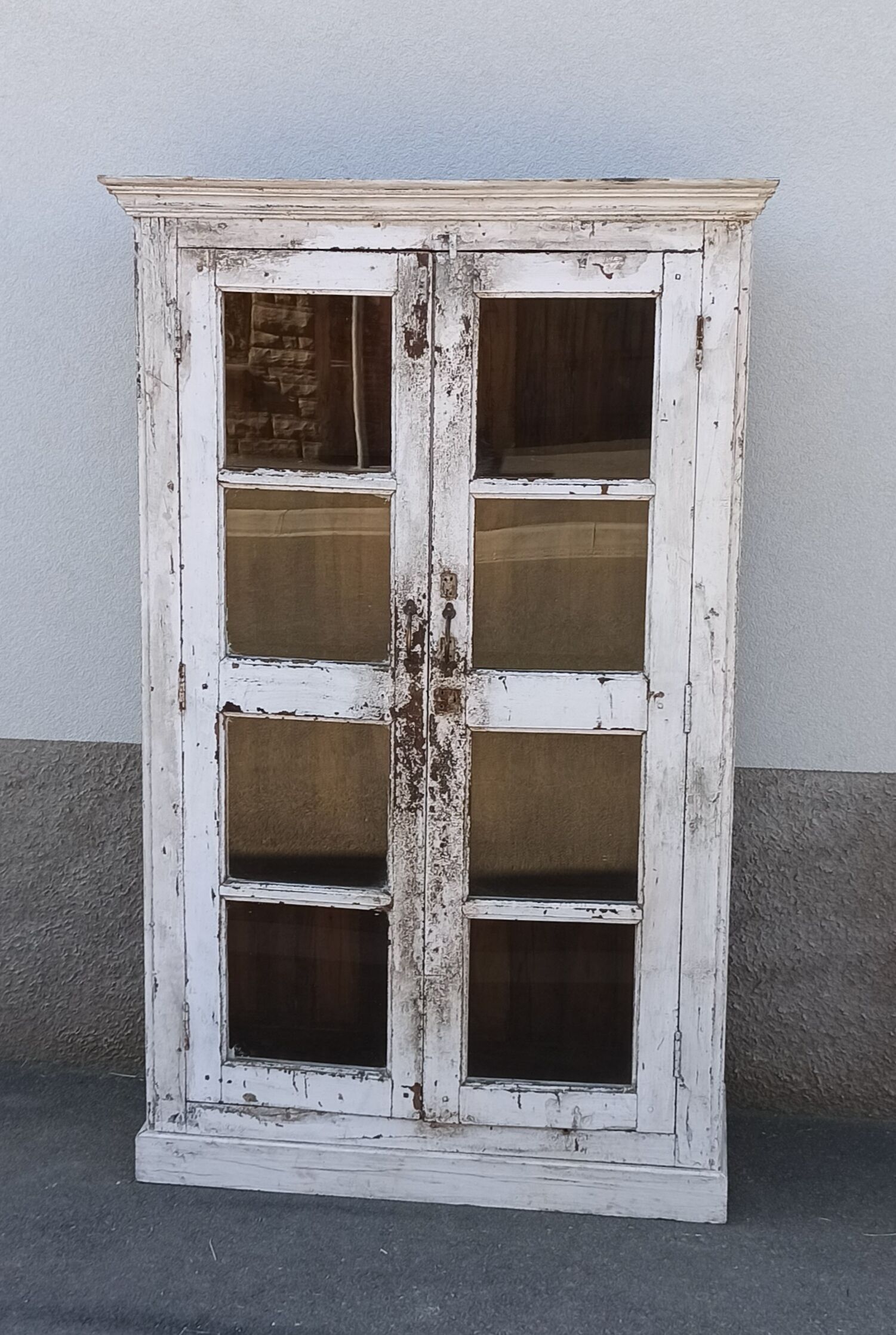 White wooden antique glazed wardrobe