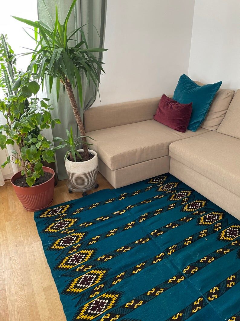 Romanian handwoven carpet with blue ground and yellow details