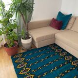 Romanian handwoven carpet with blue ground and yellow details