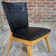 Chair 50 years in wood and faux black leather cocktail