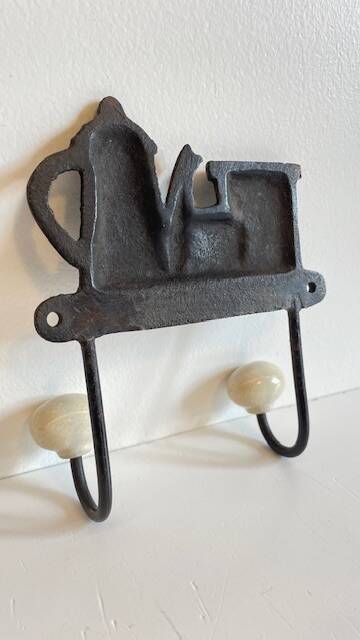 Coat rack made of steel and porcelain