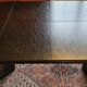 Baumann-type table with 4/8-person extensions.