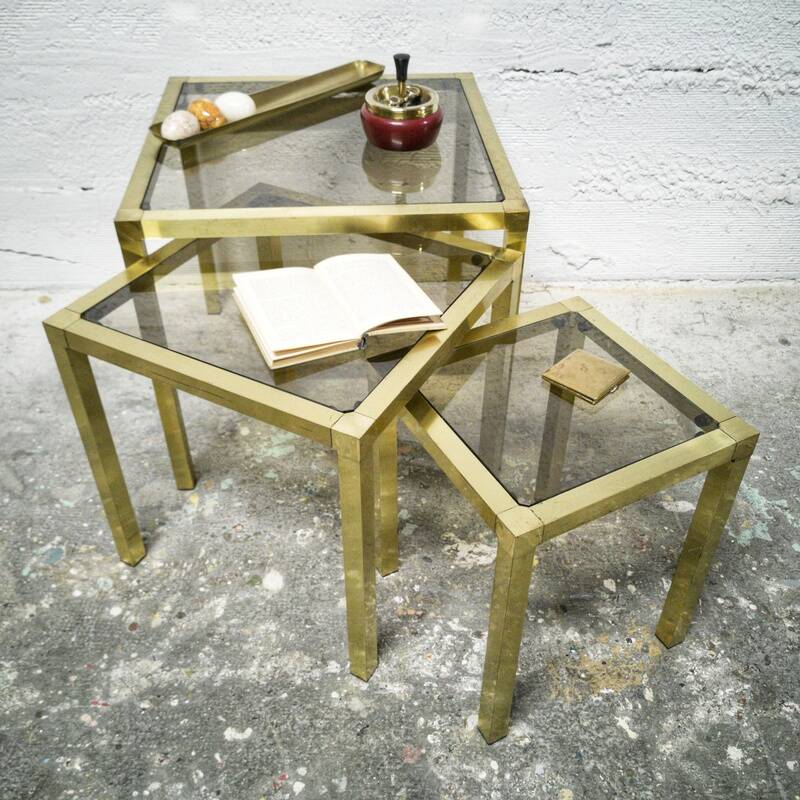 Trio of nesting tables in brass and smoked glass