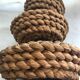 Fruit tray display in braided rope on 3 levels