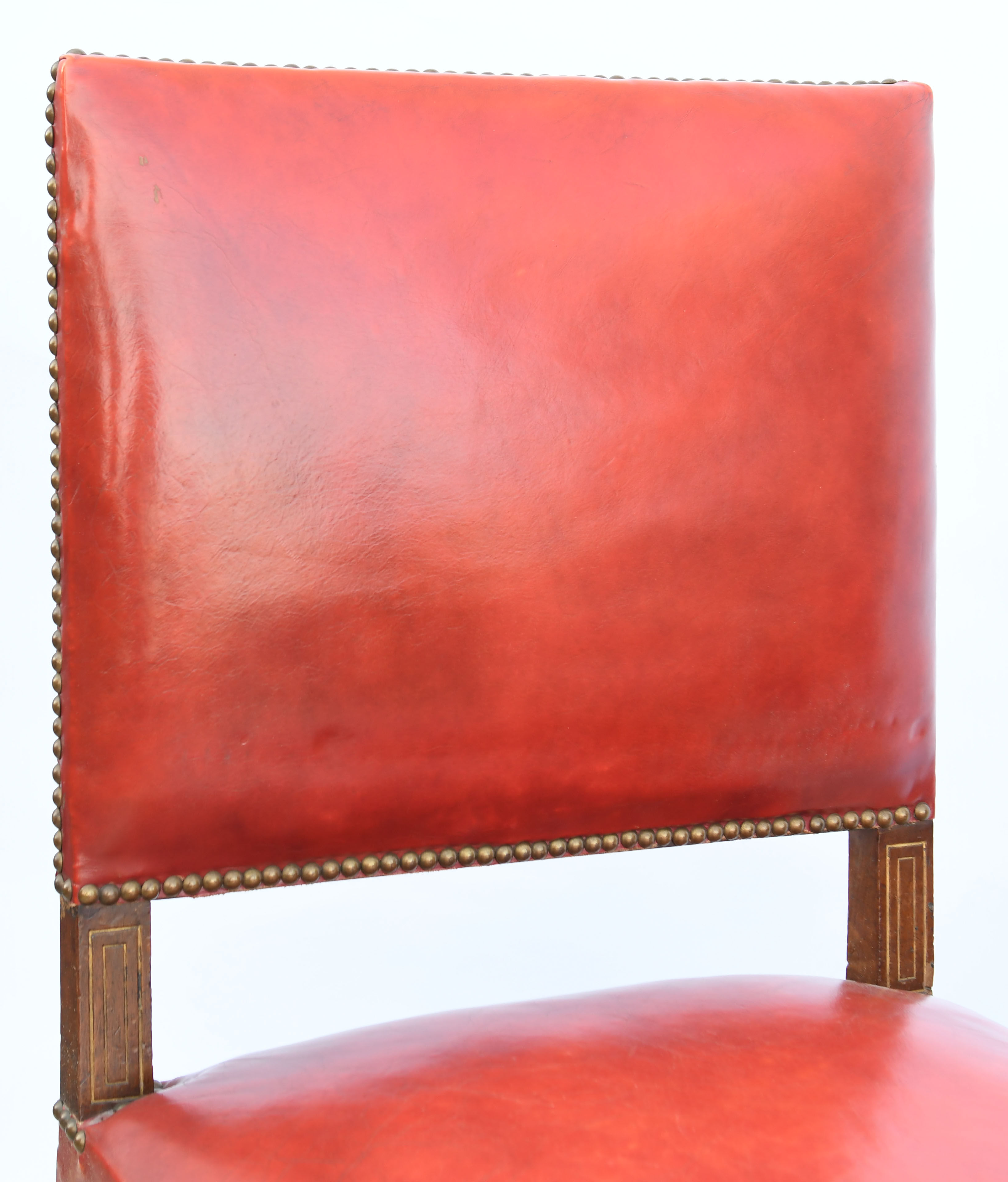 6 red leather chairs
