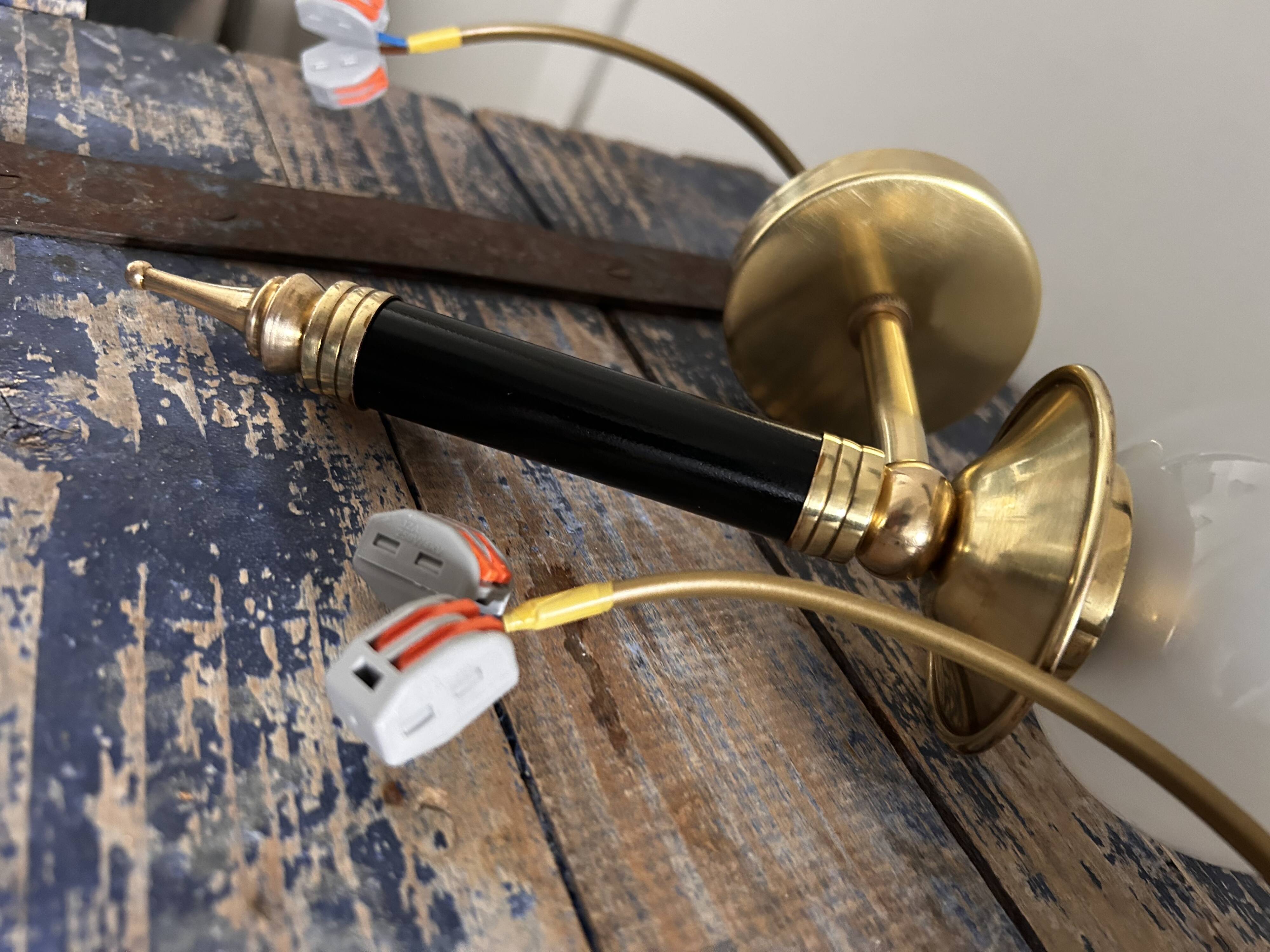 Pair of brass and black torchiere wall lights