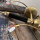 Pair of brass and black torchiere wall lights