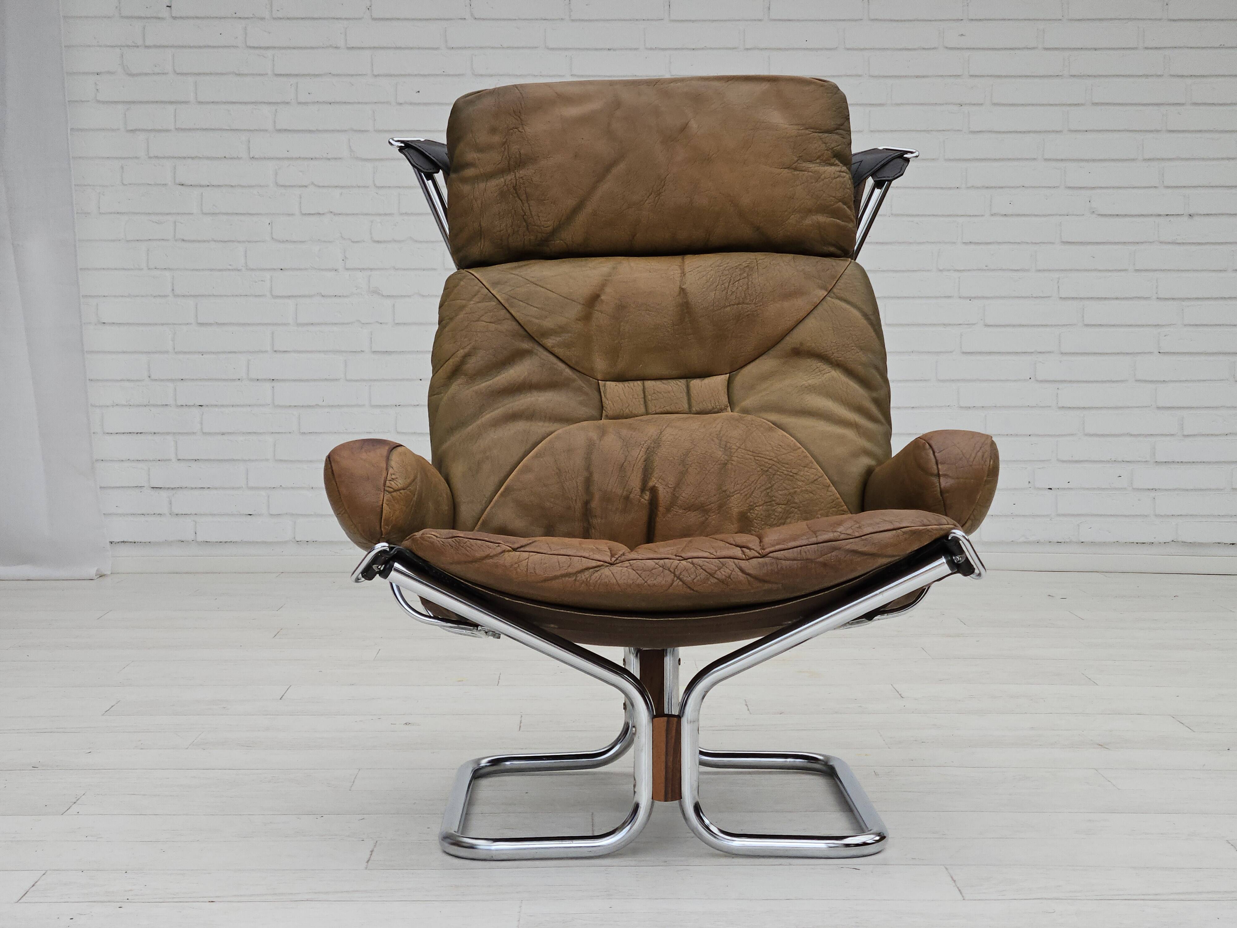 1970s, Norwegian design by Harald Relling, original condition, leather, chrome steel, teak wood.