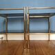 Pair of bedside tables, end of sofas in brass and vintage smoked glass