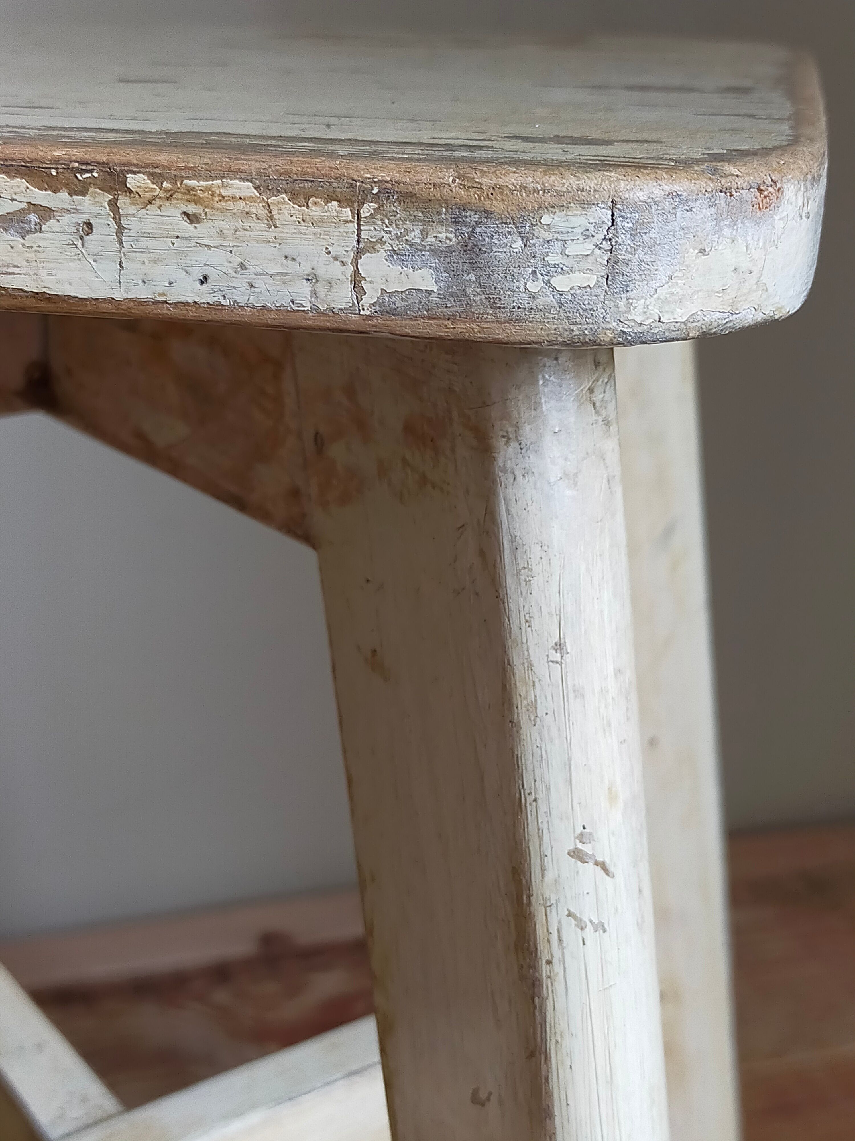 Old workshop stool in patinated solid wood