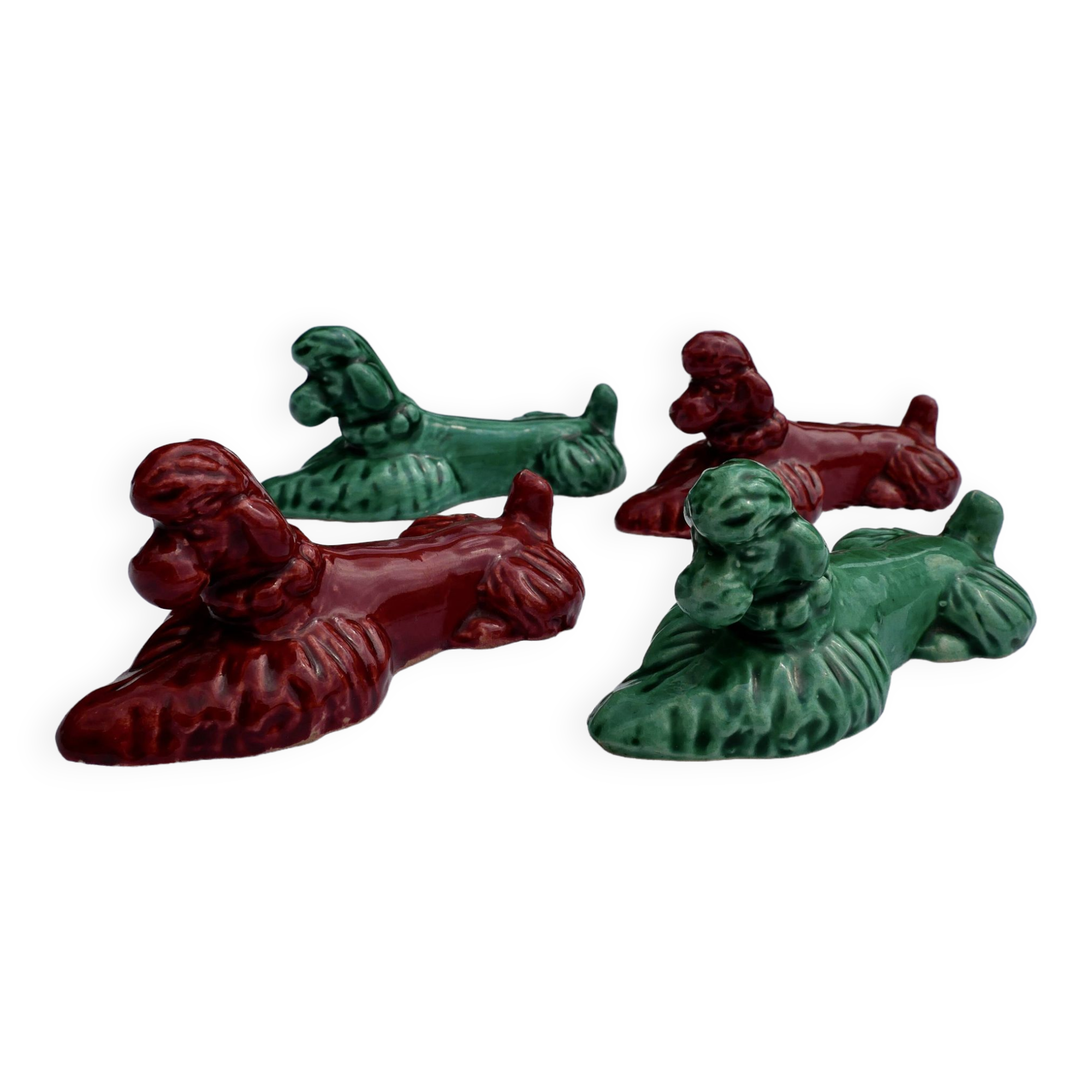 4 knife holders in the shape of poodles