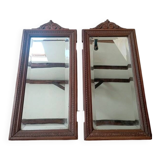 Set of two bevelled mirrors in moulded oak.