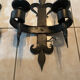 Pair of wrought iron wall lights in fleur-de-lis château style.