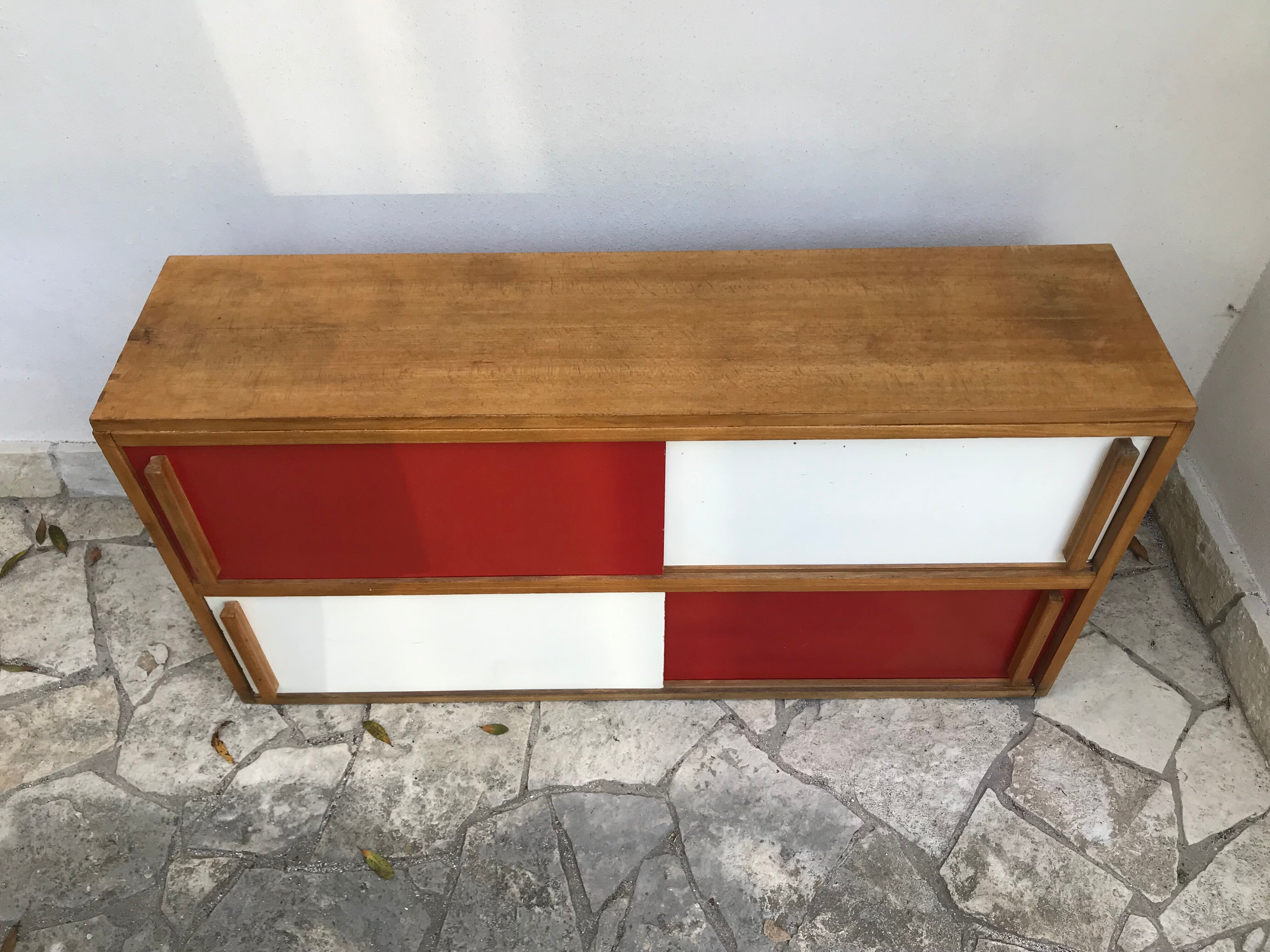 Storage cabinet with sliding doors circa 1950