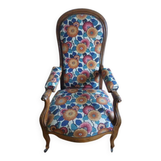Voltaire armchair with a rack, wheels, and a toad chair in matching fabric.